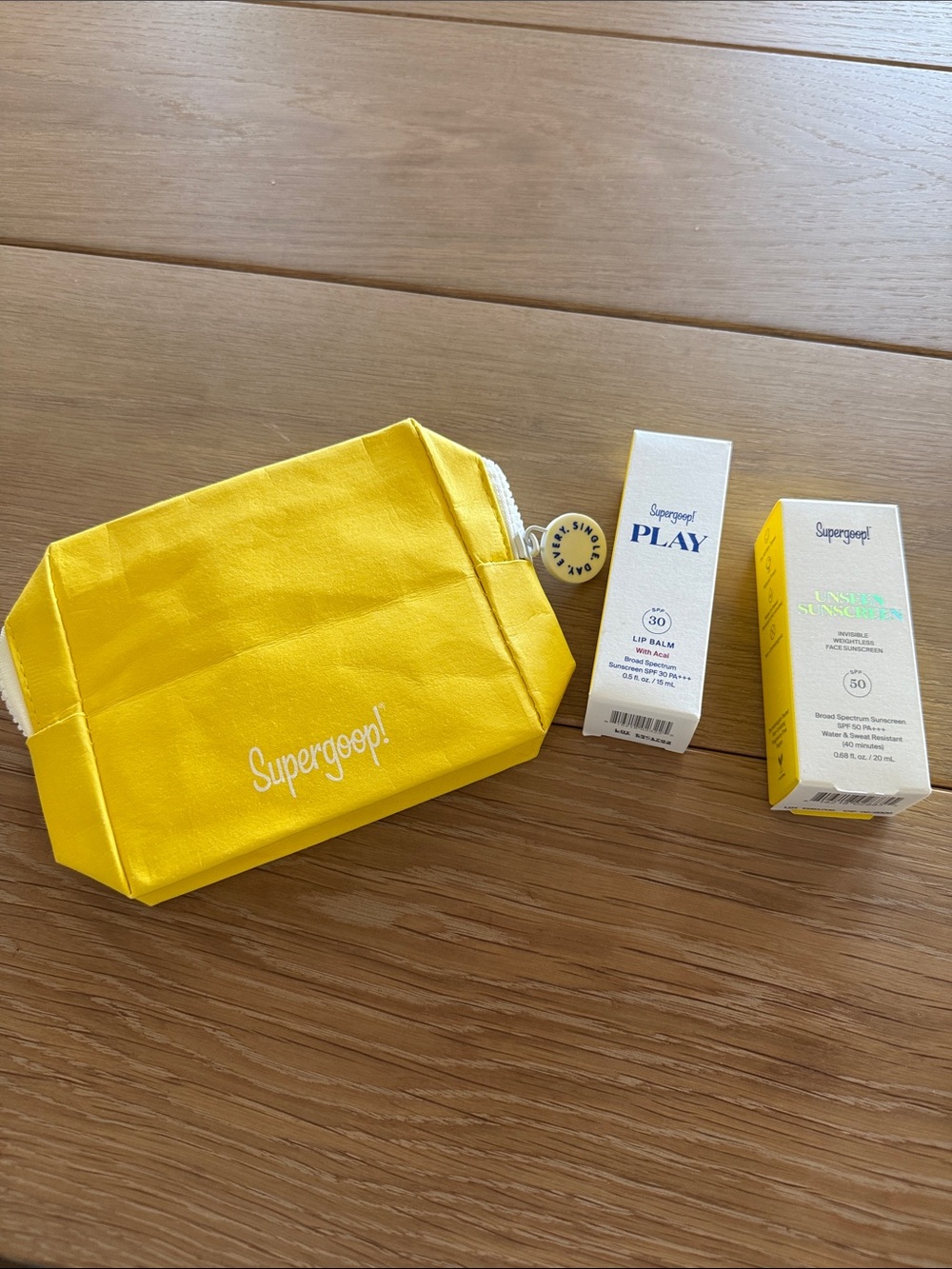 Supergoop! Bright Yellow Cosmetic Pouch with Play Lip Balm and Unseen Sunscreen